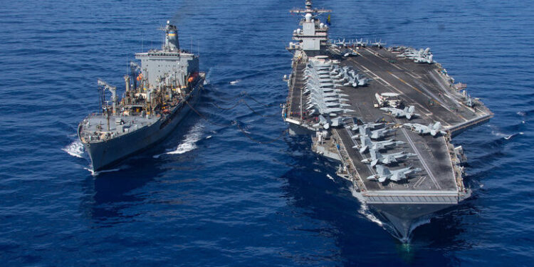 In this image released by the US Department of Defense, the world's largest aircraft carrier USS Gerald R. Ford sails during a fueling-at-sea operation from the replenishment oiler USNS Laramie (L) in the eastern Mediterranean Sea, October 11, 2023. US President Joe Biden dispatched the carrier and its fleet to the region in a show of support for Israel, also warned Hamas-backer Iran to "be careful." US officials said another carrier would soon be available if needed. (Photo by Jacob Mattingly / US Department of Defense / AFP) / RESTRICTED TO EDITORIAL USE - MANDATORY CREDIT "AFP PHOTO /  US Department of Defense/US Navy/Mass Communication Specialist 2nd Class Jacob Mattingly" - NO MARKETING NO ADVERTISING CAMPAIGNS - DISTRIBUTED AS A SERVICE TO CLIENTS