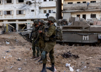 Israeli soldiers stand amid the rubble, during the ongoing ground invasion against Palestinian Islamist group Hamas in the northern Gaza Strip, November 8, 2023. REUTERS/Ronen Zvulun EDITOR’S NOTE: REUTERS PHOTOGRAPHS WERE REVIEWED BY THE IDF AS PART OF THE CONDITIONS OF THE EMBED. NO PHOTOS WERE REMOVED.