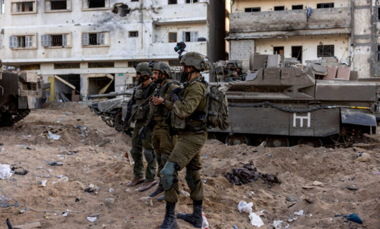 Israeli soldiers stand amid the rubble, during the ongoing ground invasion against Palestinian Islamist group Hamas in the northern Gaza Strip, November 8, 2023. REUTERS/Ronen Zvulun EDITOR’S NOTE: REUTERS PHOTOGRAPHS WERE REVIEWED BY THE IDF AS PART OF THE CONDITIONS OF THE EMBED. NO PHOTOS WERE REMOVED.