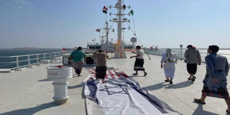 People tour the deck of the Galaxy Leader commercial ship, seized by Yemen's Houthis last month, off the coast of al-Salif, Yemen December 5, 2023. REUTERS/Khaled Abdullah