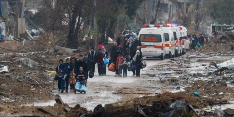 Palestinians fleeing north Gaza move southward as ambulances head towards north Gaza during a temporary truce between Israel and Hamas, near Gaza City, November 27, 2023. REUTERS/Ibraheem Abu Mustafa