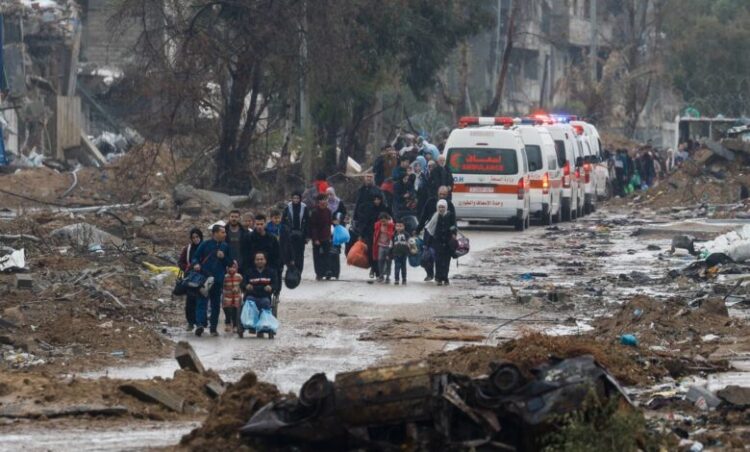 Palestinians fleeing north Gaza move southward as ambulances head towards north Gaza during a temporary truce between Israel and Hamas, near Gaza City, November 27, 2023. REUTERS/Ibraheem Abu Mustafa