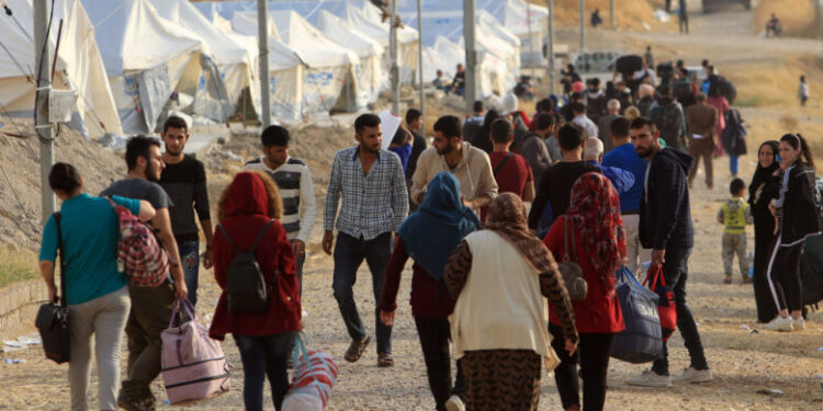 Syrian displaced families, who fled violence after the Turkish offensive in Syria, are seen upon arrival at a refugee camp in Bardarash on the outskirts of Dohuk, Iraq October 25, 2019. REUTERS/Ari Jalal