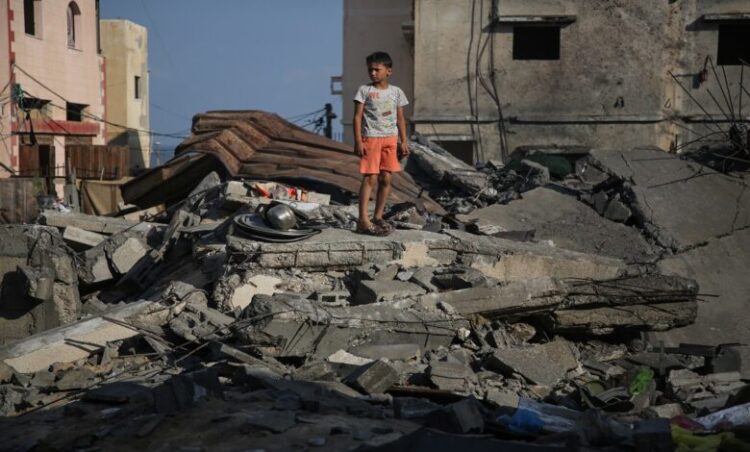 A Palestinian boy inspects damage outside a residential building in Gaza City August 8, 2022, following a cease fire proposed by Egypt between the Israeli army and Palestinian militants. - Israel agreed last night to an Egyptian proposed truce with in Gaza with Islamic Jihad after three days of intense conflict, an Egyptian source said. 
 (Photo by Majdi Fathi/NurPhoto via Getty Images)