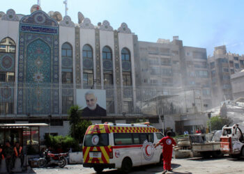 An ambulance is parked outside the Iranian embassy after a suspected Israeli strike on Monday on Iran's consulate, adjacent to the main Iranian embassy building, which Iran said had killed seven military personnel including two key figures in the Quds Force, in the Syrian capital Damascus, Syria April 2, 2024. REUTERS/Firas Makdesi