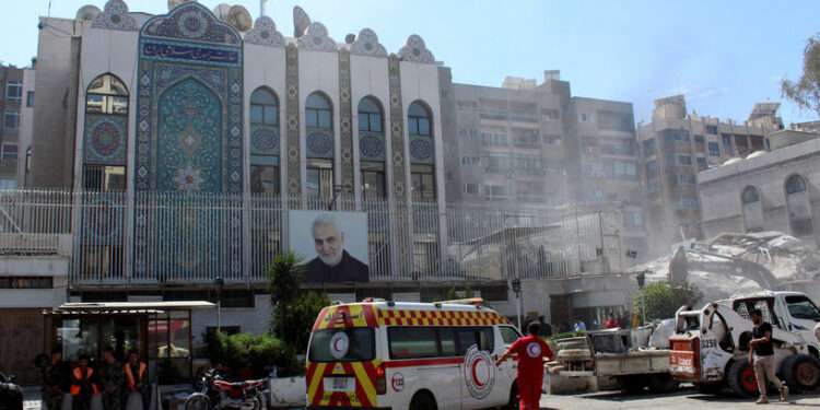 An ambulance is parked outside the Iranian embassy after a suspected Israeli strike on Monday on Iran's consulate, adjacent to the main Iranian embassy building, which Iran said had killed seven military personnel including two key figures in the Quds Force, in the Syrian capital Damascus, Syria April 2, 2024. REUTERS/Firas Makdesi