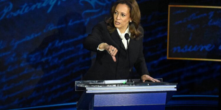 TOPSHOT - US Vice President and Democratic presidential candidate Kamala Harris gives a thumbs down during a presidential debate with former US President and Republican presidential candidate Donald Trump at the National Constitution Center in Philadelphia, Pennsylvania, on September 10, 2024. (Photo by SAUL LOEB / AFP)