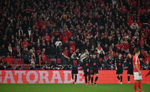LISBON, PORTUGAL - MARCH 5: Raphinha of FC Barcelona celebrates after scoring his sides first goal during the UEFA Champions League 2024/25 UEFA Champions League 2024/25 Round of 16 first Lleg match between SL Benfica and FC Barcelona at  on March 5, 2025 in Lisbon, Portugal. (Photo by MB Media/Getty Images)