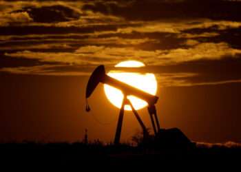 FILE - The sun sets behind an idle pump jack near Karnes City, USA, April 8, 2020. Oil prices are sagging amid fears of recessions across the globe. OPEC and allied countries are weighing what to do about that when they meet online Thursday, Sept. 8, 2022. High oil prices were a bonanza for countries like Saudi Arabia over the summer, but now they're well off those highs. Saudi Arabia's oil minister has even said the group known as OPEC+ could cut production at any time. (AP Photo/Eric Gay, File)